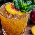 peach bourbon smash cocktail - featured image